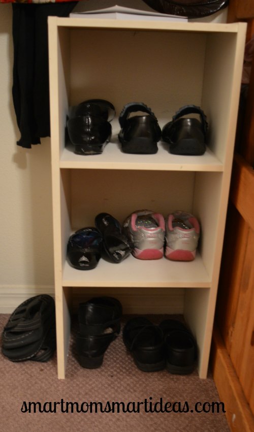 Organizing shoes at the foot of the bed